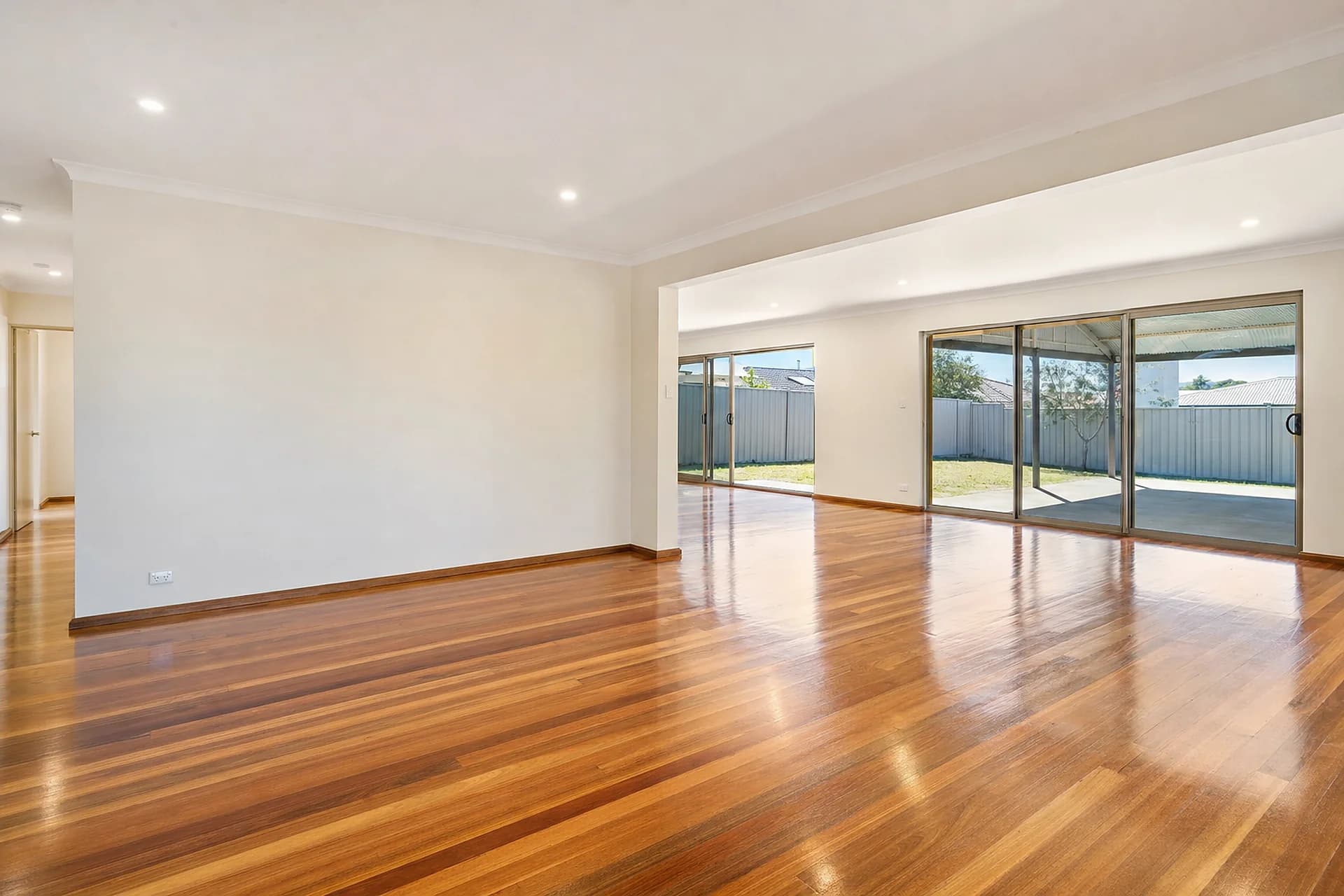 Empty Perth living area with polished floorboards after a vacate clean
